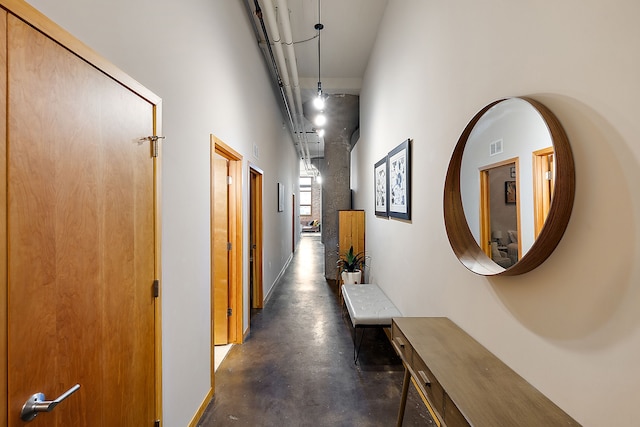 hallway featuring a high ceiling