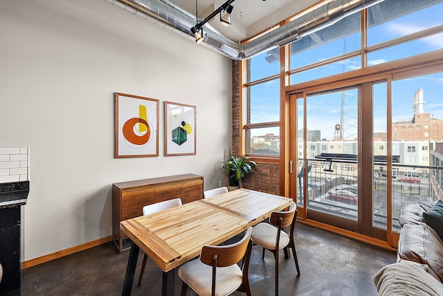 dining room with a high ceiling