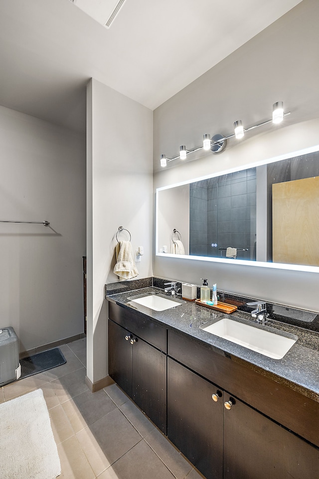 bathroom with vanity and tile patterned flooring