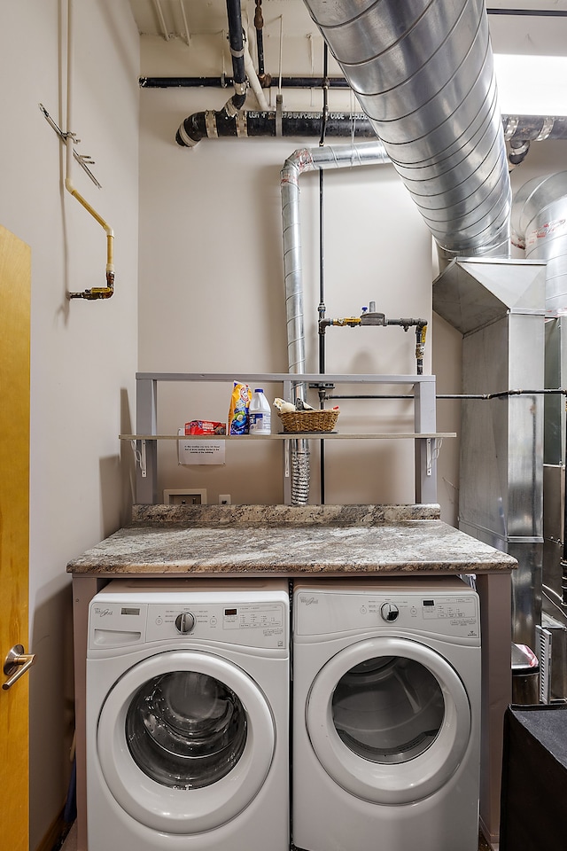 laundry area with washing machine and dryer