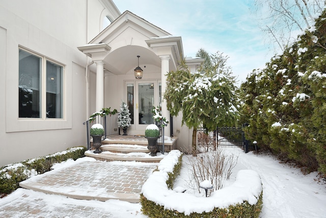 view of snow covered property entrance