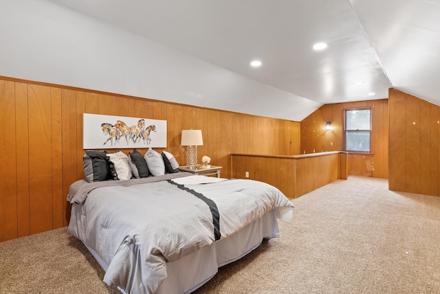 bedroom featuring vaulted ceiling and carpet