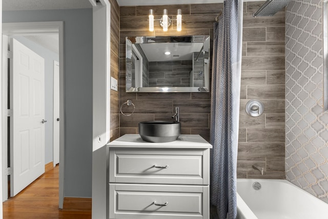 bathroom with vanity and shower / bath combo with shower curtain