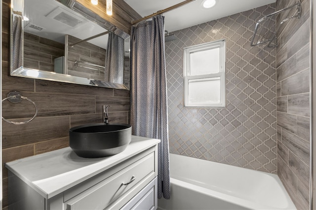 bathroom featuring vanity, tasteful backsplash, and shower / tub combo with curtain