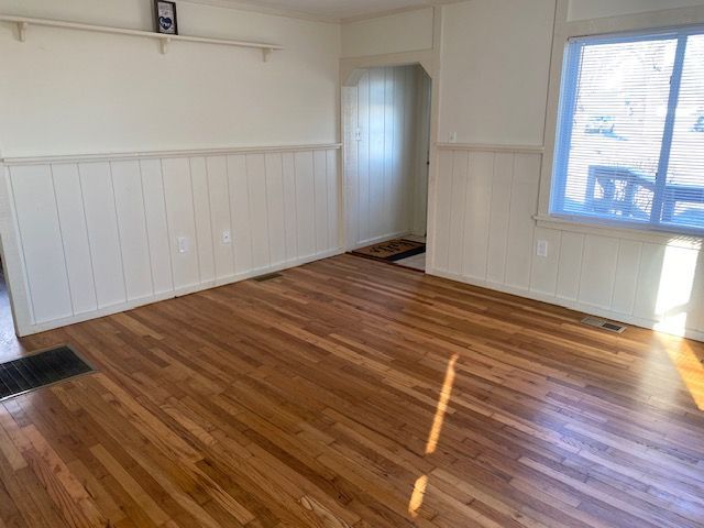 empty room with wood-type flooring