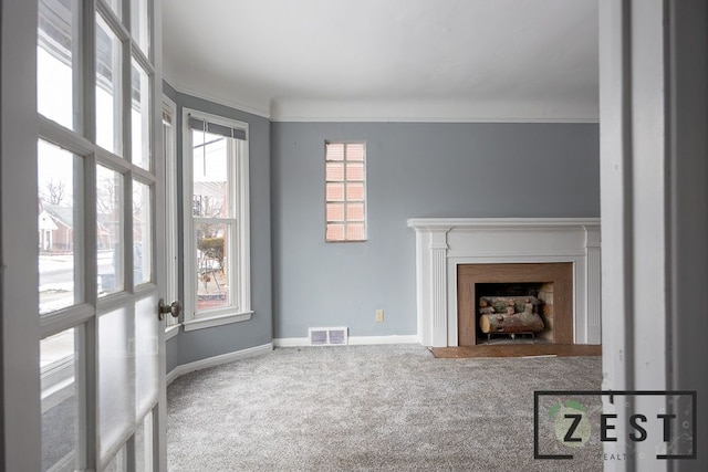 carpeted living room featuring ornamental molding