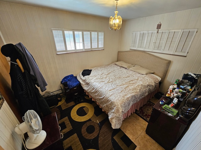 bedroom with light tile patterned floors