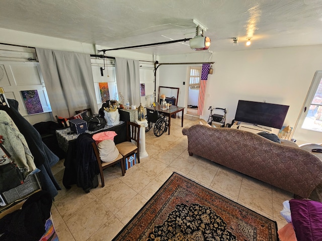 living room with light tile patterned floors and a textured ceiling