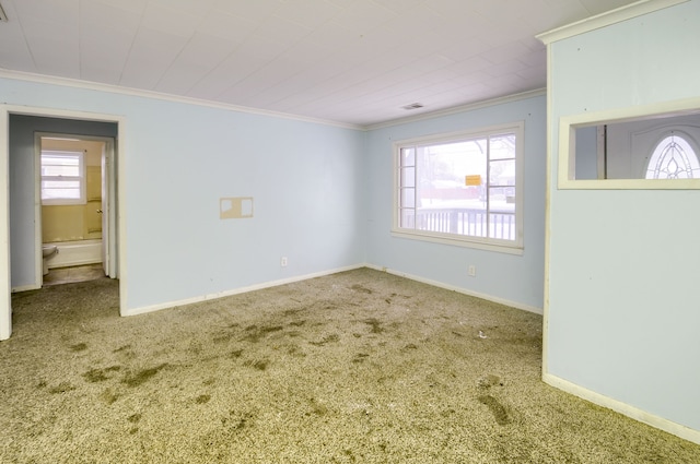 unfurnished room with carpet and crown molding