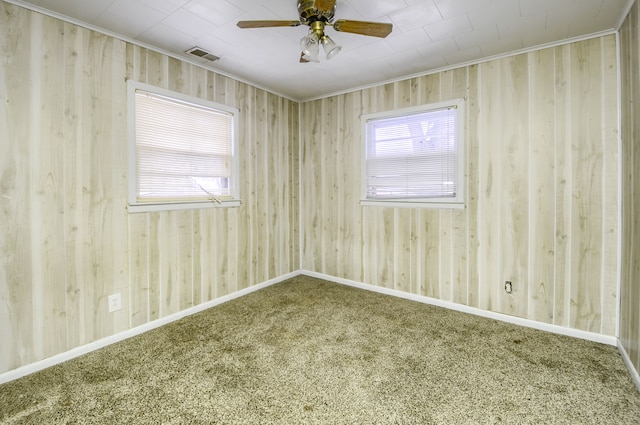 carpeted spare room with ceiling fan