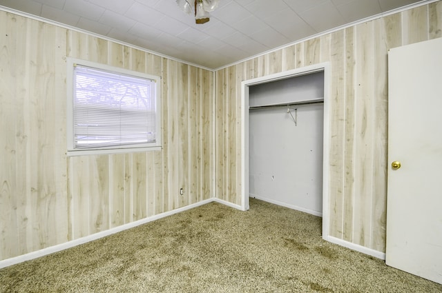 unfurnished bedroom featuring a closet and carpet flooring