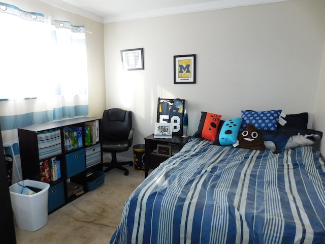 carpeted bedroom featuring crown molding