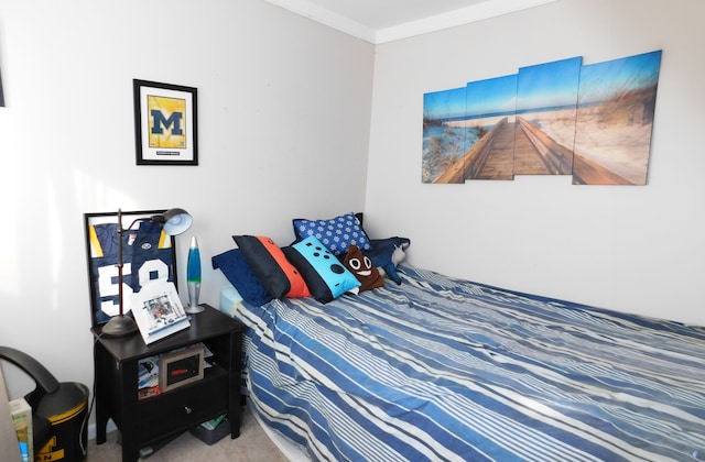 carpeted bedroom featuring ornamental molding