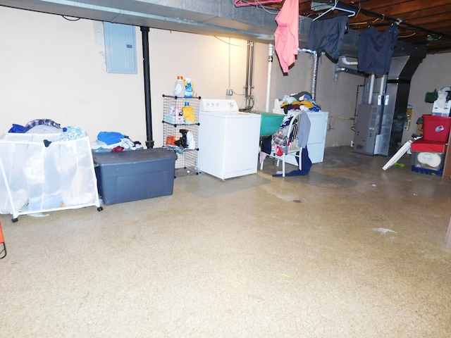 basement featuring independent washer and dryer and electric panel