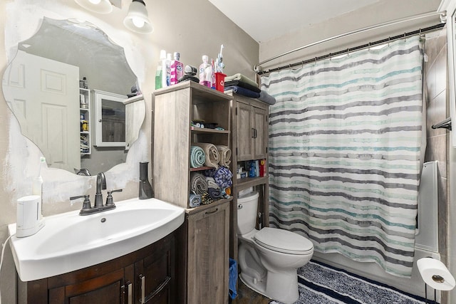 full bathroom with toilet, vanity, and shower / tub combo with curtain