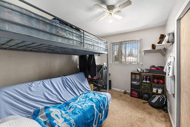 bedroom with ceiling fan and light colored carpet