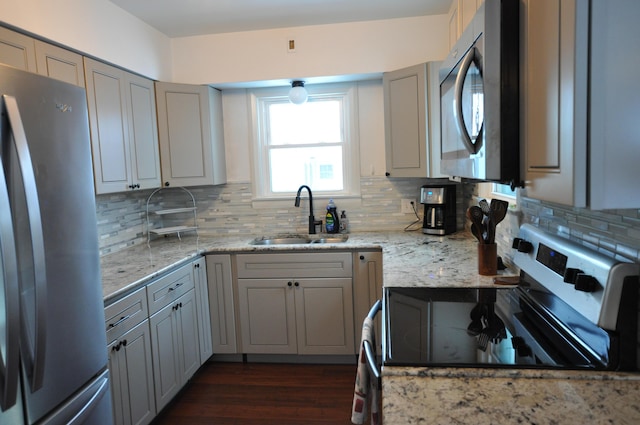 kitchen with decorative backsplash, appliances with stainless steel finishes, sink, and gray cabinets