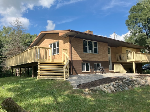 back of property featuring a patio area, a lawn, and a wooden deck