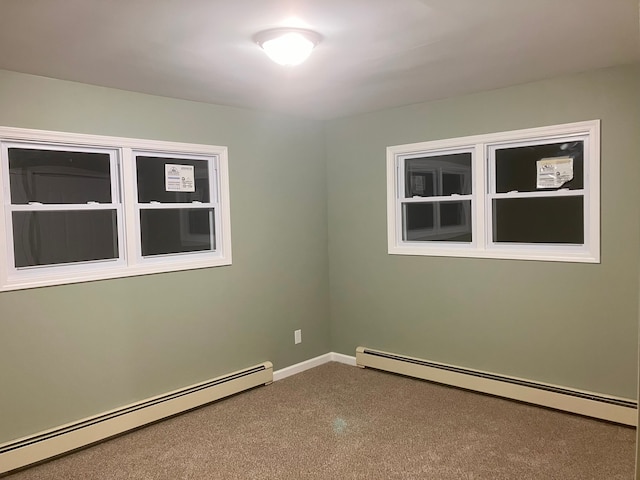 empty room featuring a baseboard heating unit