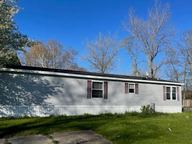 view of home's exterior featuring a yard