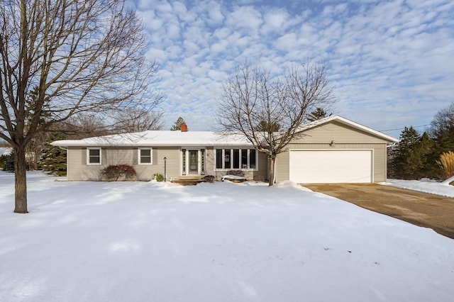 ranch-style home with a garage