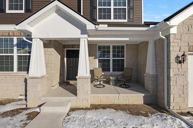 doorway to property with covered porch