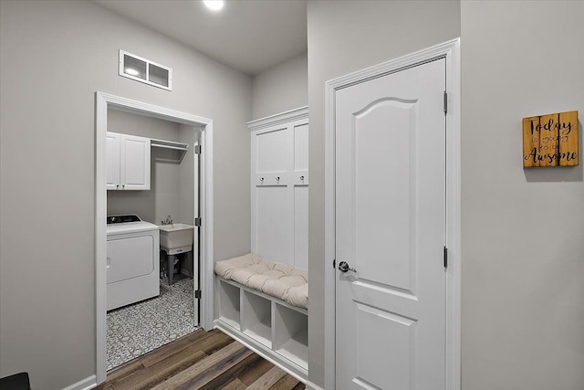 mudroom featuring washer / dryer, sink, and dark hardwood / wood-style flooring