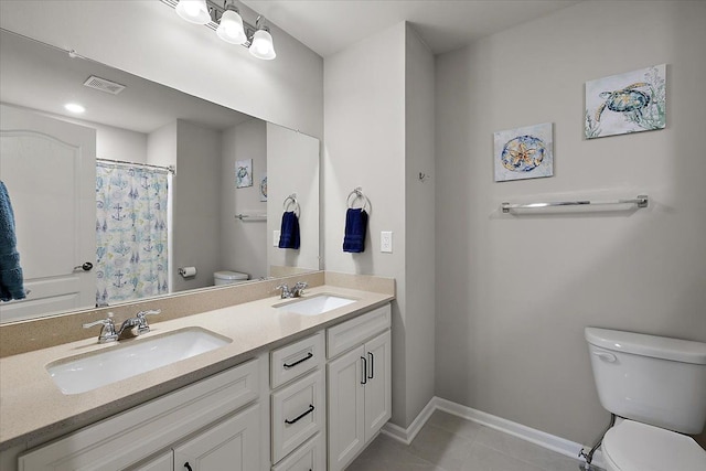 bathroom with tile patterned flooring, vanity, curtained shower, and toilet