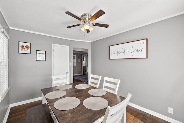 dining room featuring dark hardwood / wood-style floors, ceiling fan, and ornamental molding