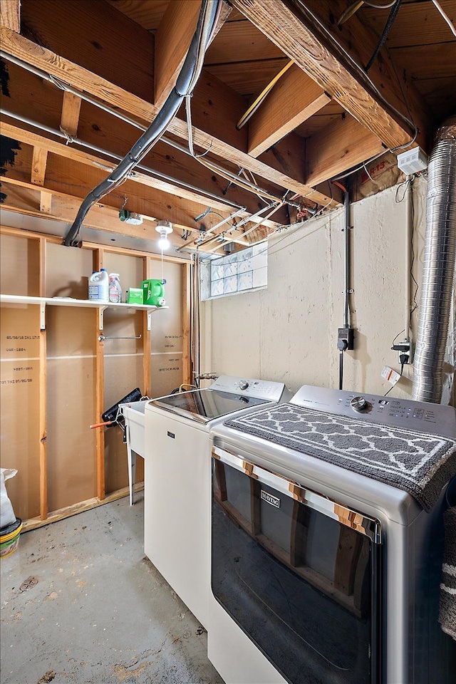 basement featuring separate washer and dryer