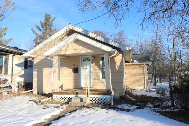 bungalow-style home with a porch