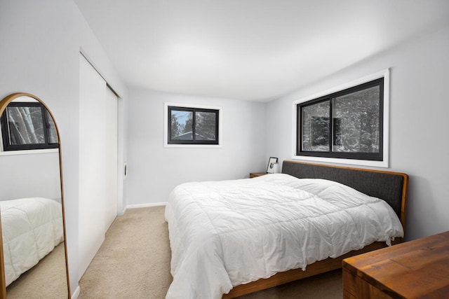 carpeted bedroom featuring a closet