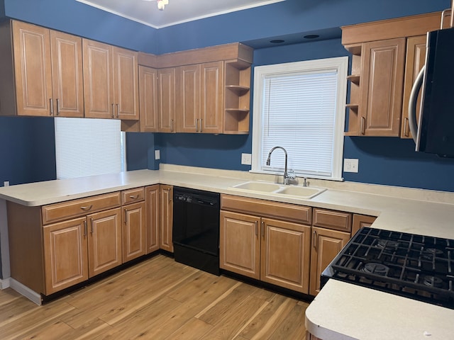 kitchen featuring black appliances, open shelves, a sink, and light countertops