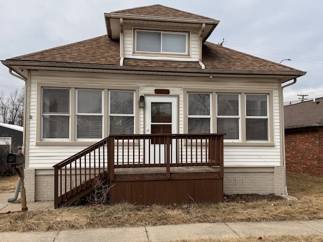 view of front of home featuring a shingled roof