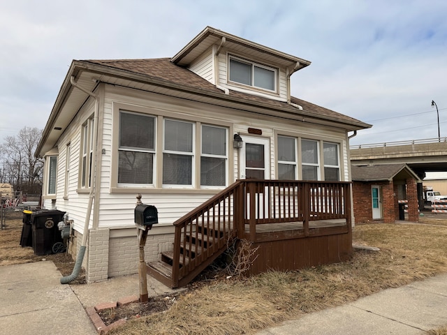 view of front of home featuring a shingled roof