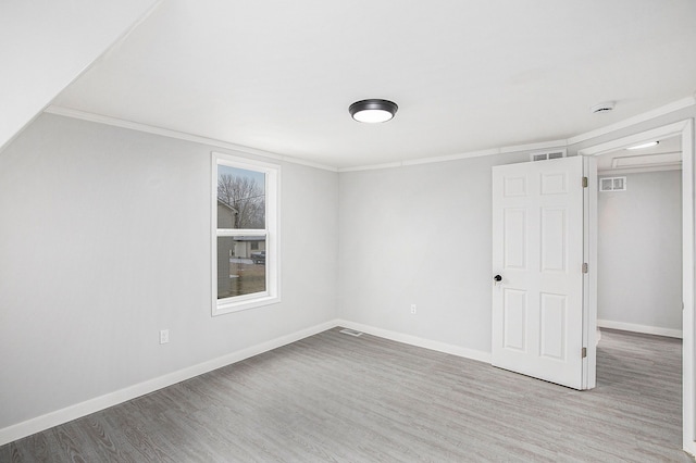 interior space with hardwood / wood-style flooring and ornamental molding