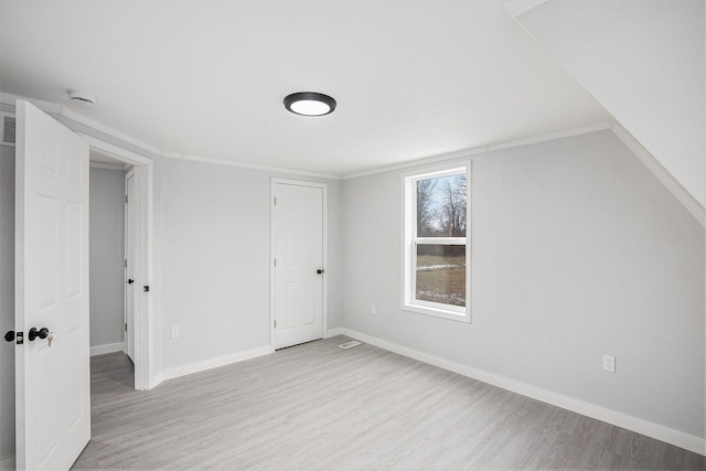 interior space featuring light wood-style flooring and baseboards