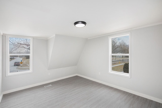 unfurnished room with hardwood / wood-style flooring