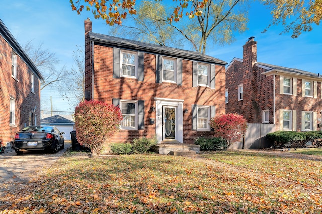 view of front facade with a garage and a front lawn