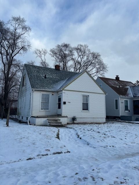 view of snow covered house