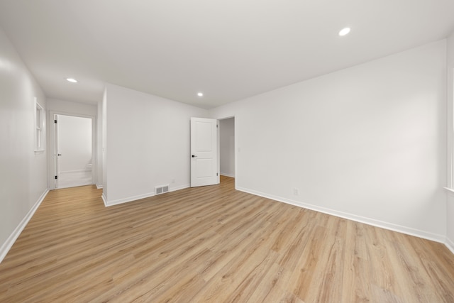 spare room featuring light wood-type flooring