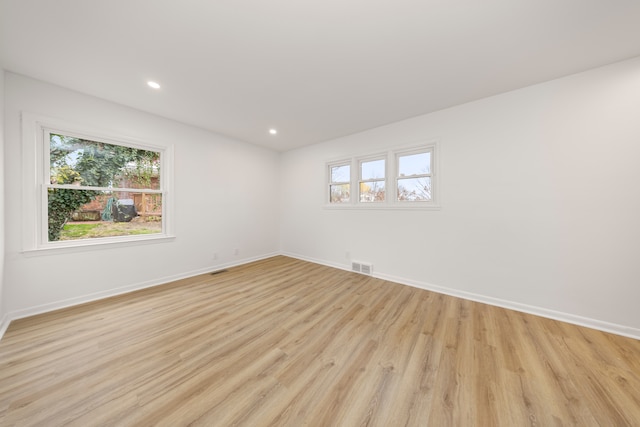 spare room featuring light wood-type flooring