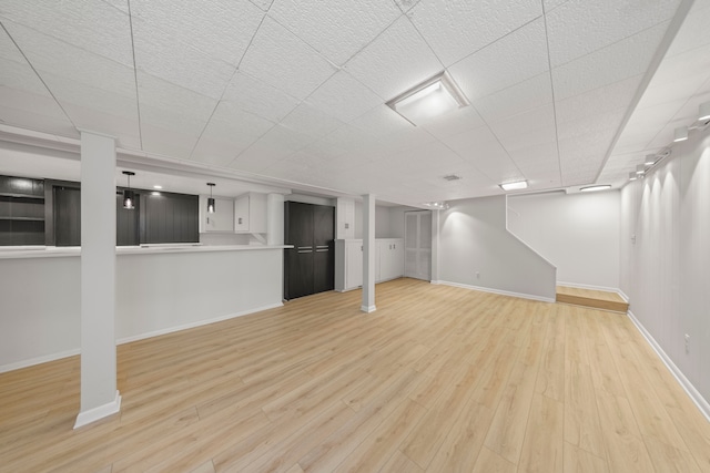 basement featuring light hardwood / wood-style flooring