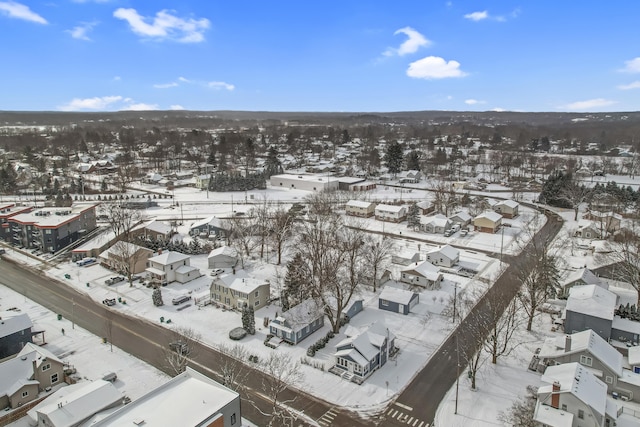 snowy aerial view featuring a residential view