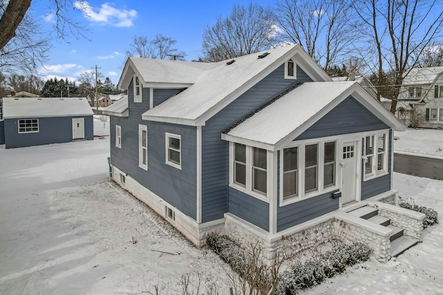 view of side of home with an outbuilding