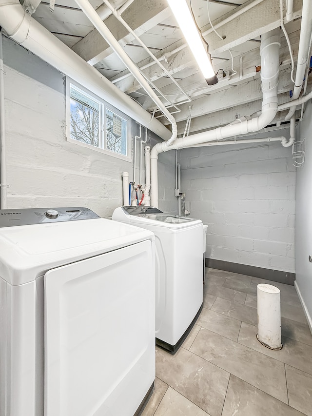 clothes washing area featuring laundry area and separate washer and dryer