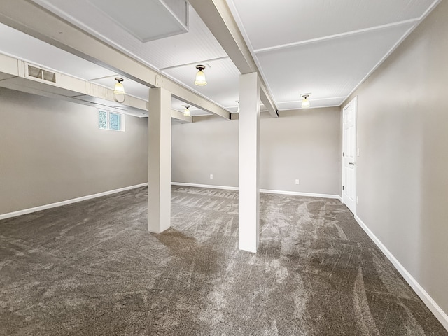 basement featuring carpet flooring, visible vents, and baseboards