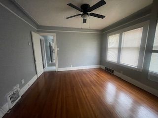 spare room featuring ceiling fan and wood-type flooring