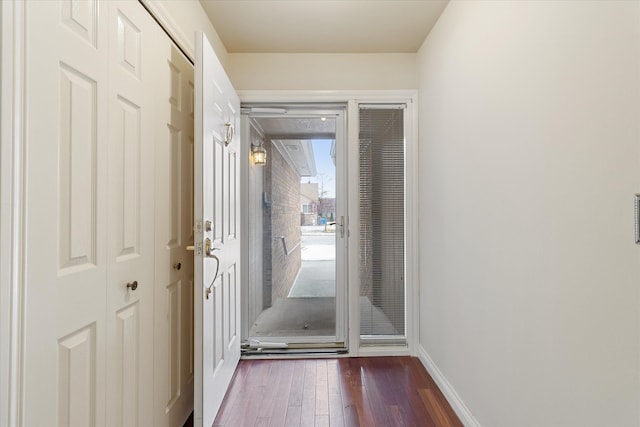 entryway with dark hardwood / wood-style floors