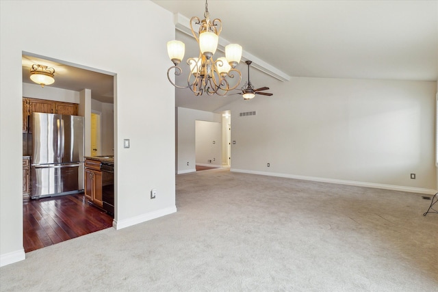 unfurnished room featuring ceiling fan with notable chandelier, dark colored carpet, and lofted ceiling with beams